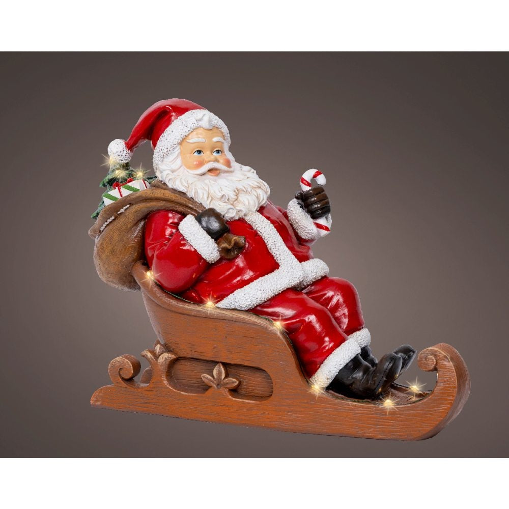 Kerstman in slee | met LED verlichting | polyresin | bruin/rood | 22,5cm